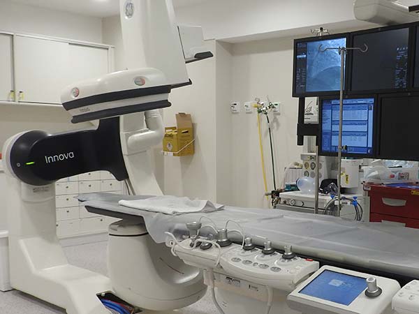 Advanced medical imaging equipment in a clinical room.