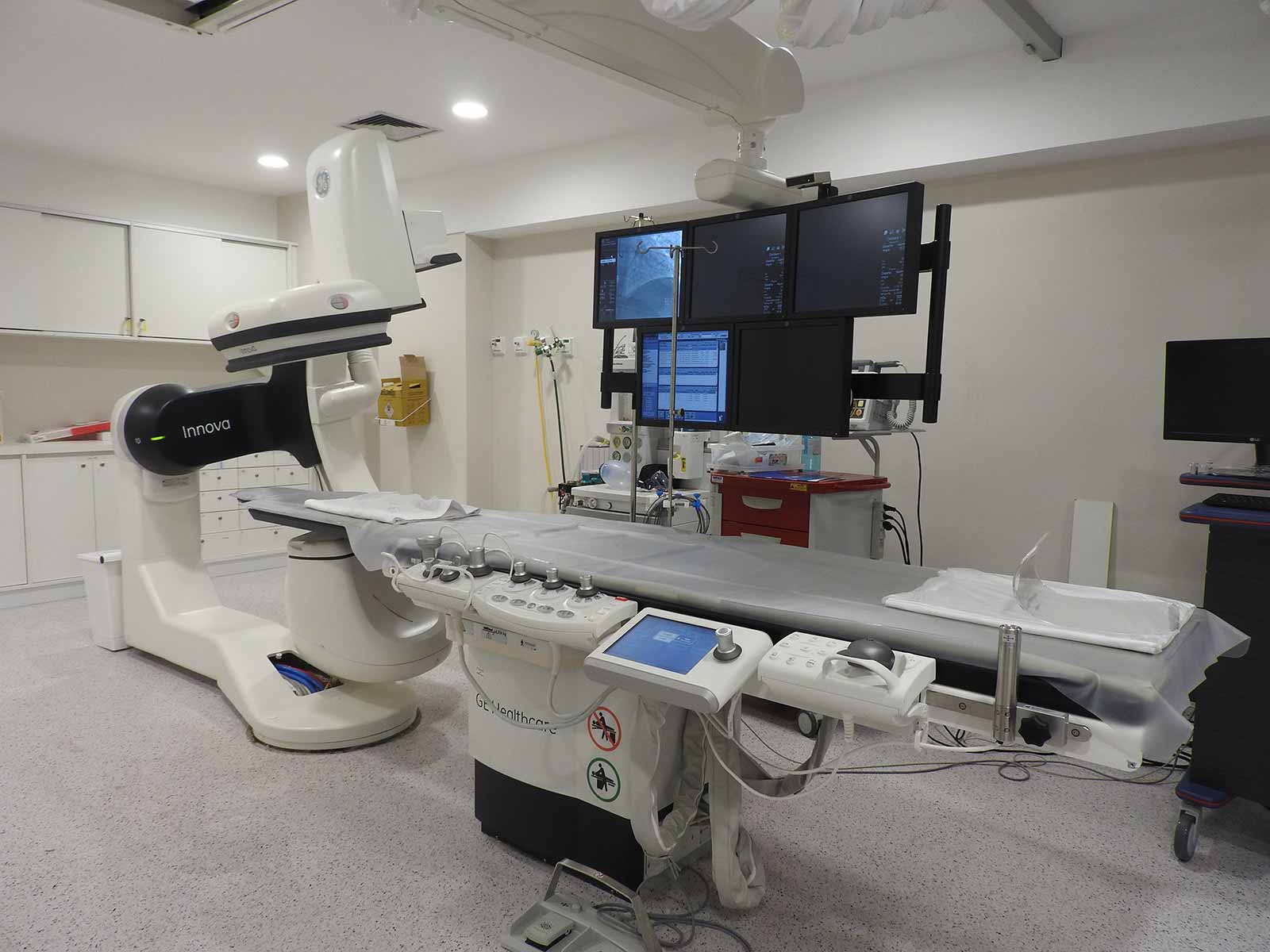 Modern medical imaging equipment in a hospital room.