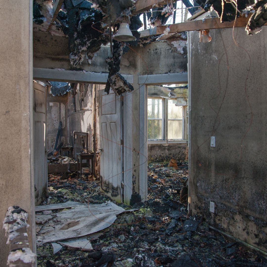 A dilapidated and trashed building 