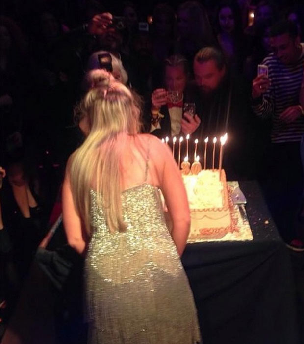 Woman in sparkly dress at birthday party.