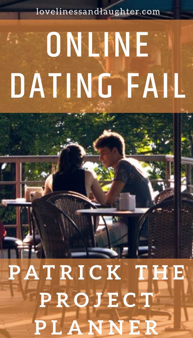 Couple sitting at outdoor cafe table.