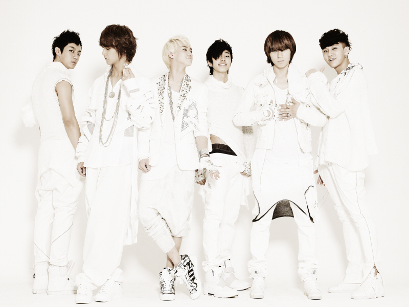 Group of six young men in white.
