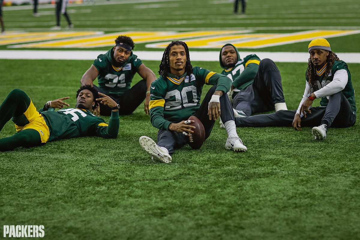Football players relaxing on the field.