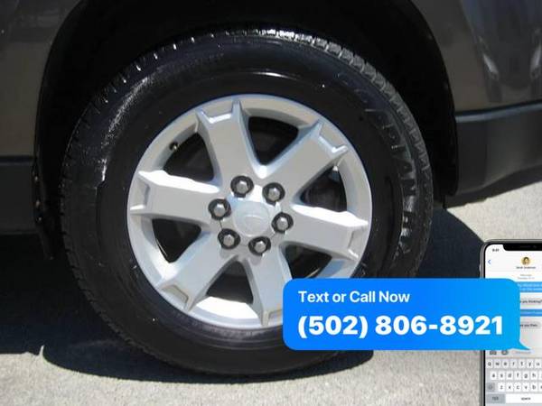 Car tire with contact number displayed nearby.