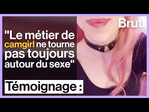 Person with pink hair and black choker.