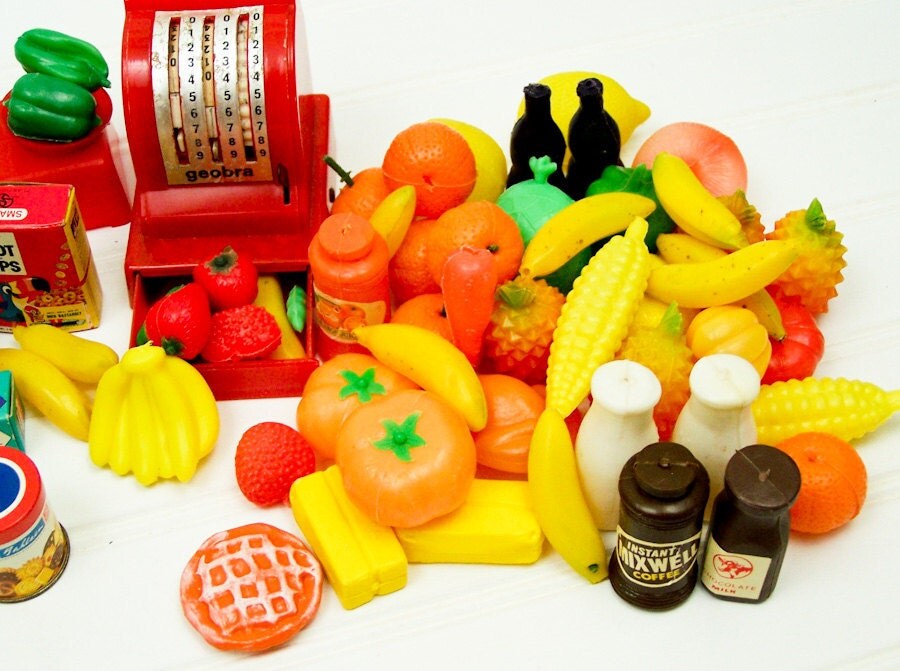 Toy fruits and vegetables with play cash register.