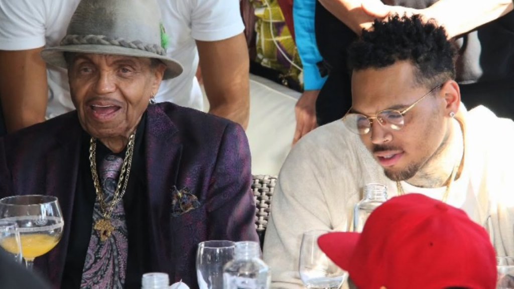Two men sitting at a social gathering.