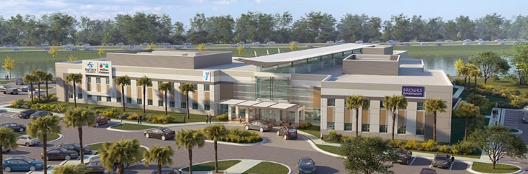 Modern medical facility with surrounding greenery.