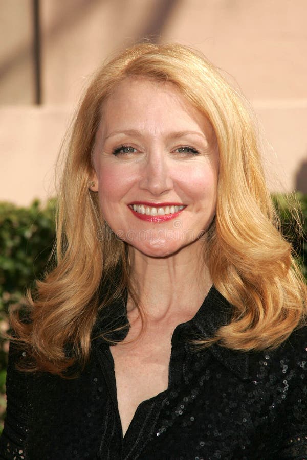 Smiling woman with long blonde hair.