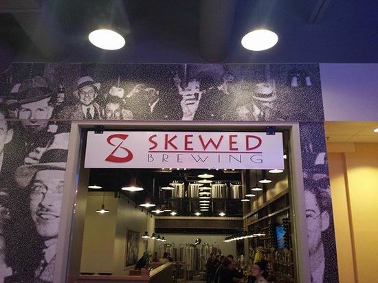 Skewed Brewing entrance with interior view.